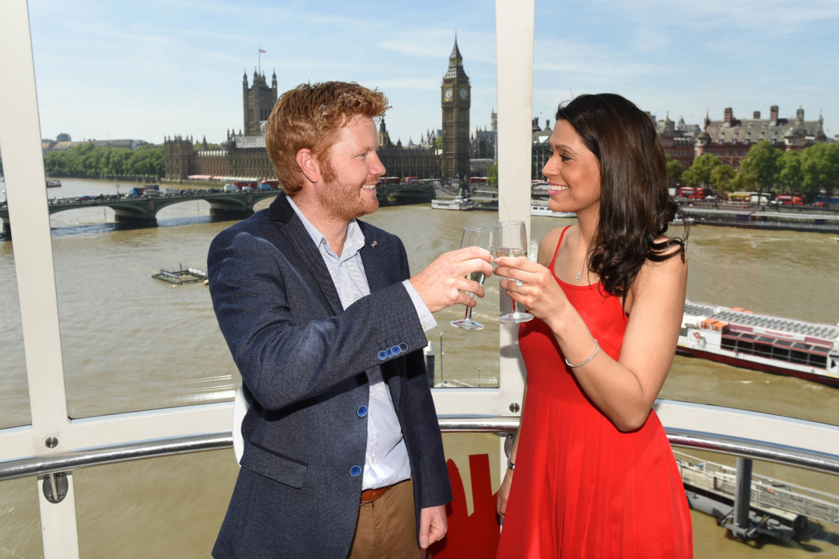 Cheers! Professional lookalikes Andrew Witter and Leila Karmarpour raise a glass after the proposal